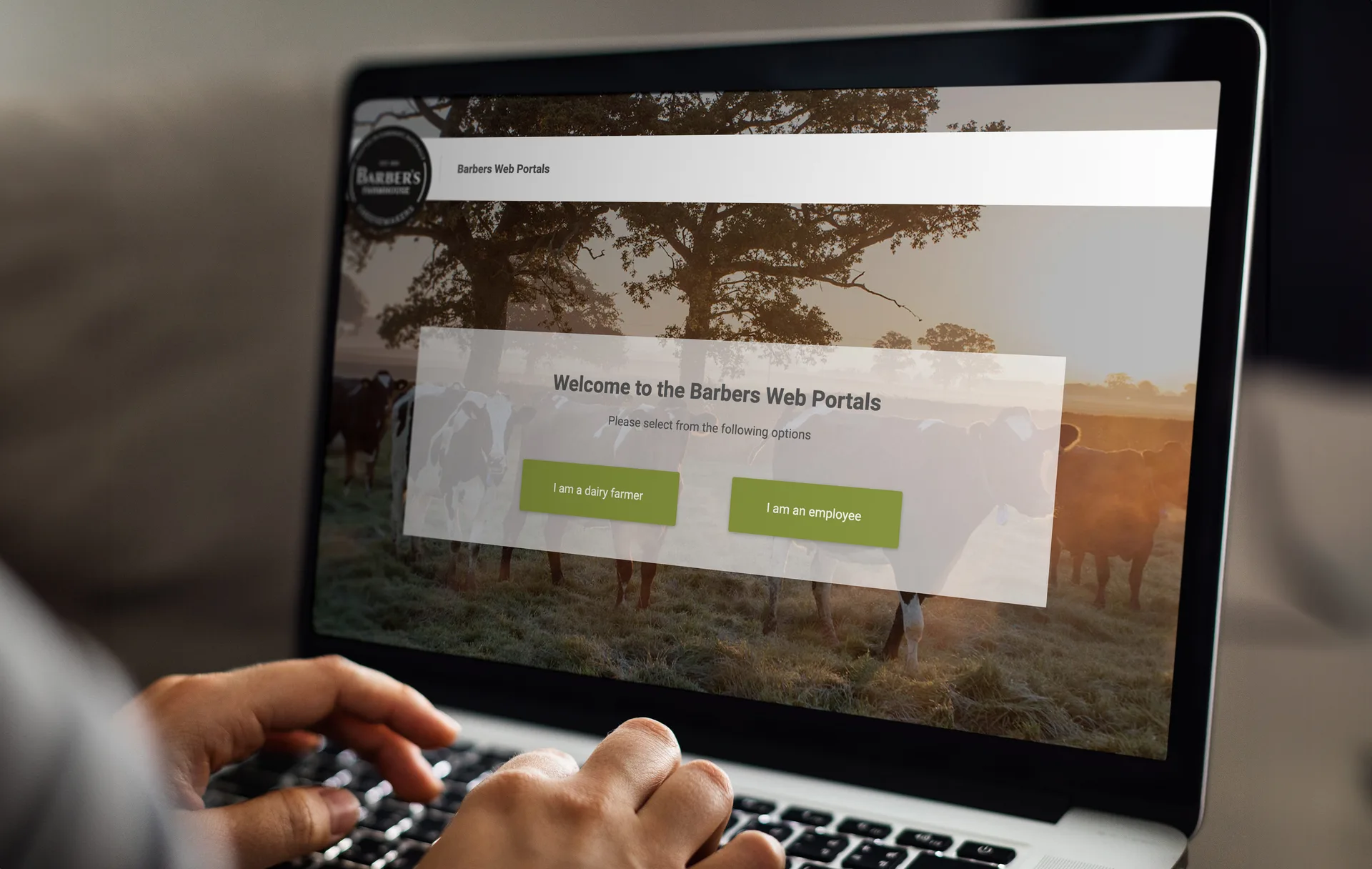 Barbers Milk Portal login page on laptop