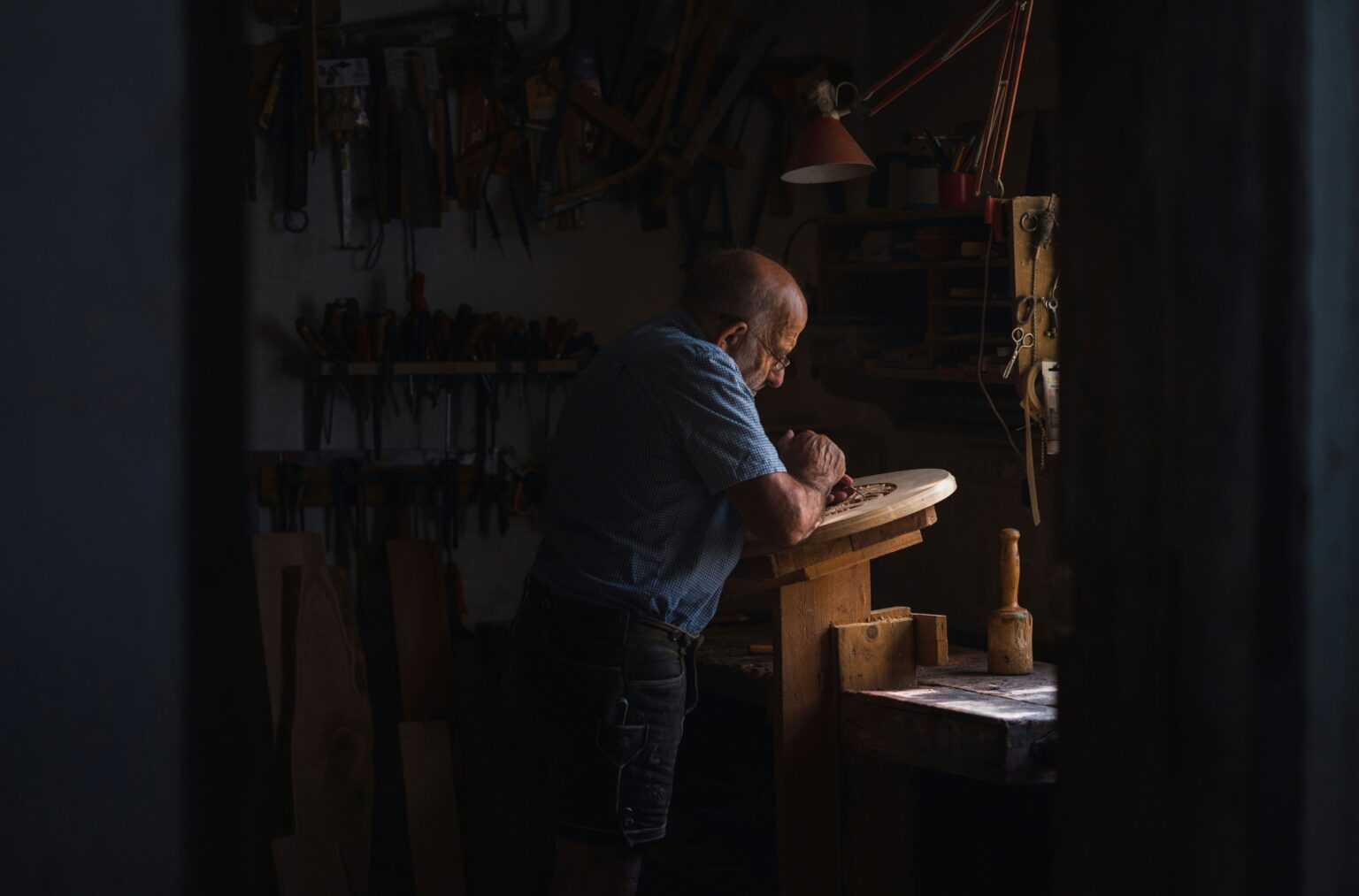 Cheverell Kitchens promotional shot showing a craftsman at work