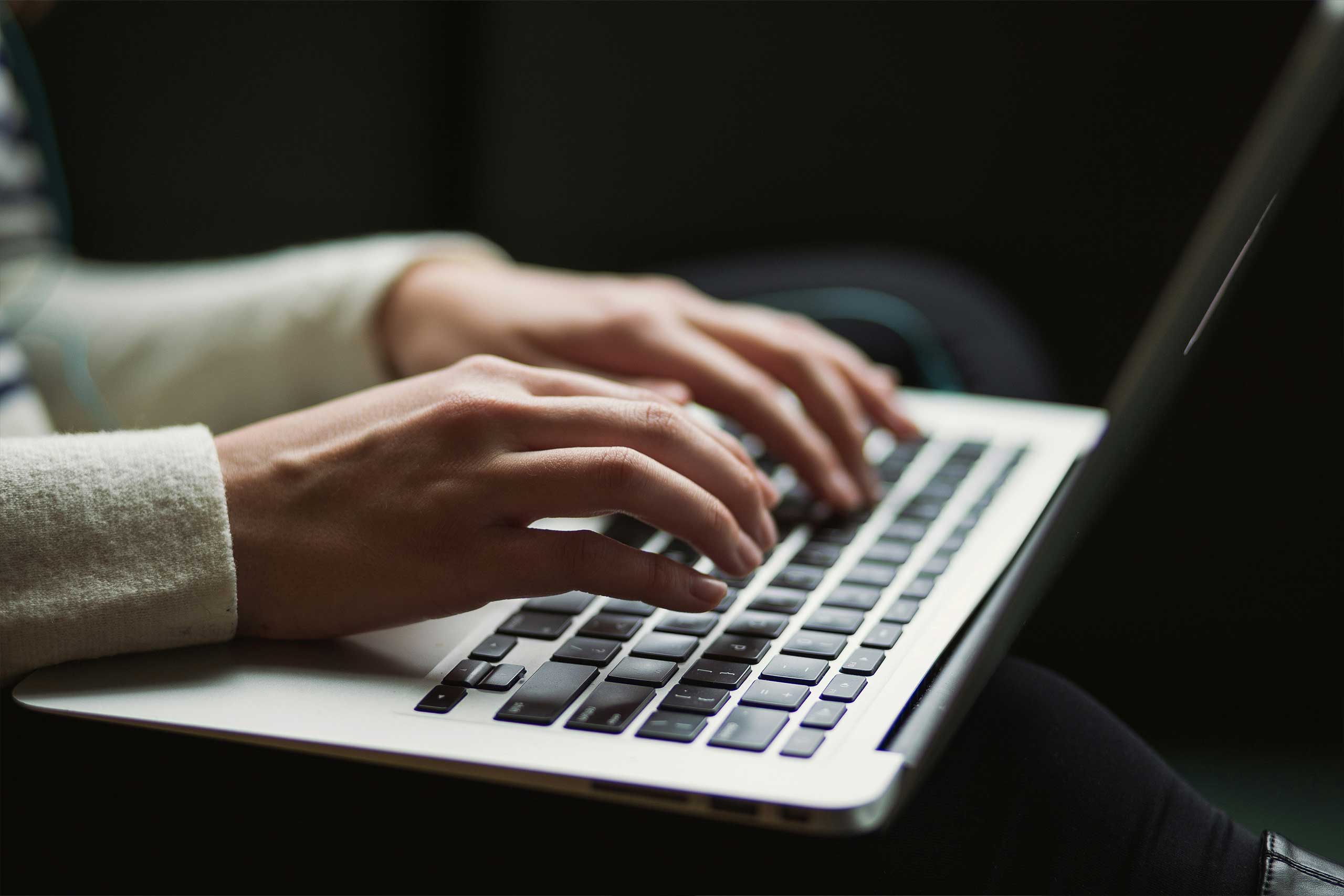 Switching made simple with man typing on laptop