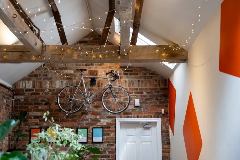 Inside the Resolution studio in Devizes showing bike on the wall